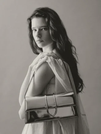The long Bambino Long metal flap bag