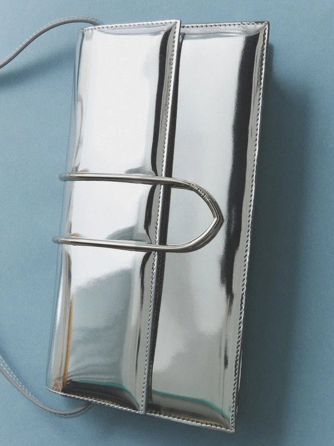 The long Bambino Long metal flap bag The long Bambino Long metal flap bag