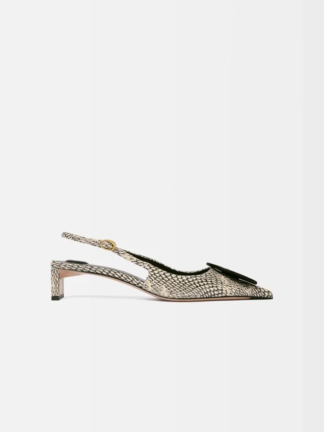 The low Duelo slingbacks Circle and square kitten heels The low Duelo slingbacks Circle and square kitten heels