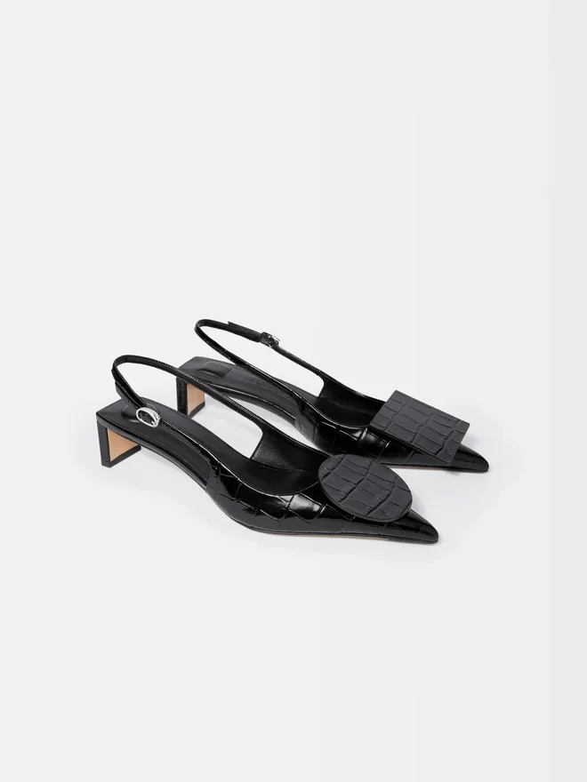 The low Duelo slingbacks Circle and square kitten heels The low Duelo slingbacks Circle and square kitten heels