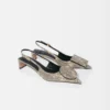 The low Duelo slingbacks Circle and square kitten heels The low Duelo slingbacks Circle and square kitten heels
