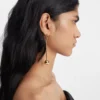 The Nodo earrings Rhinestoned dangle earrings