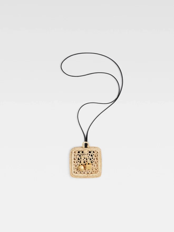 The Spiaggia wallet Raffia AirPods holder The Spiaggia wallet Raffia AirPods holder