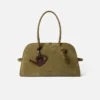 The watering can Watering can-shaped bag charm The watering can Watering can-shaped bag charm